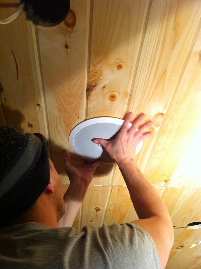 installing speakers on a wood plank ceiling