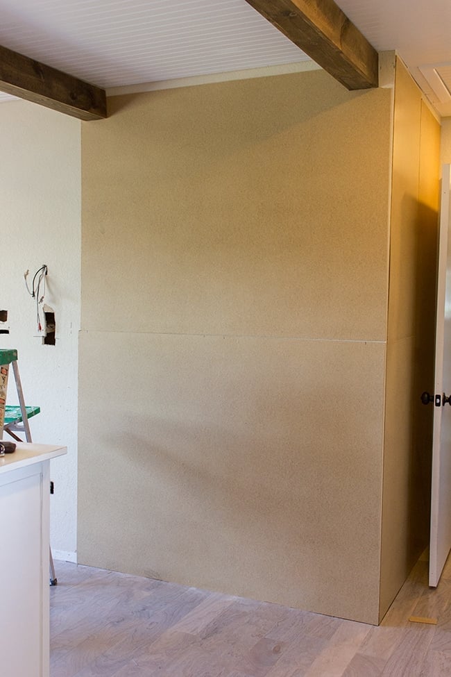 covering textured walls with hardboard panels