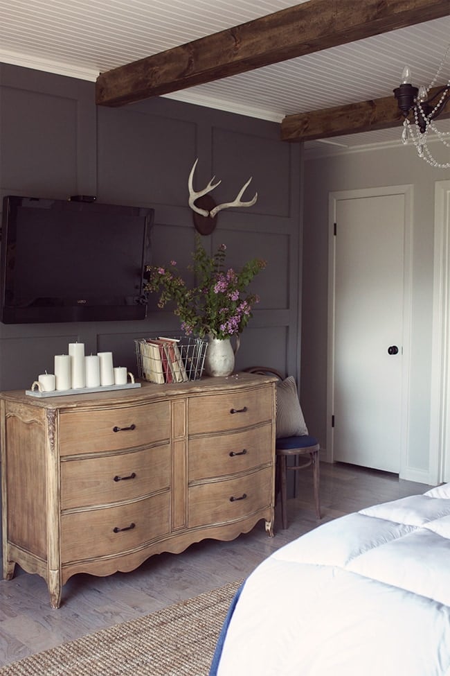 natural wood vintage dresser in a bedroom