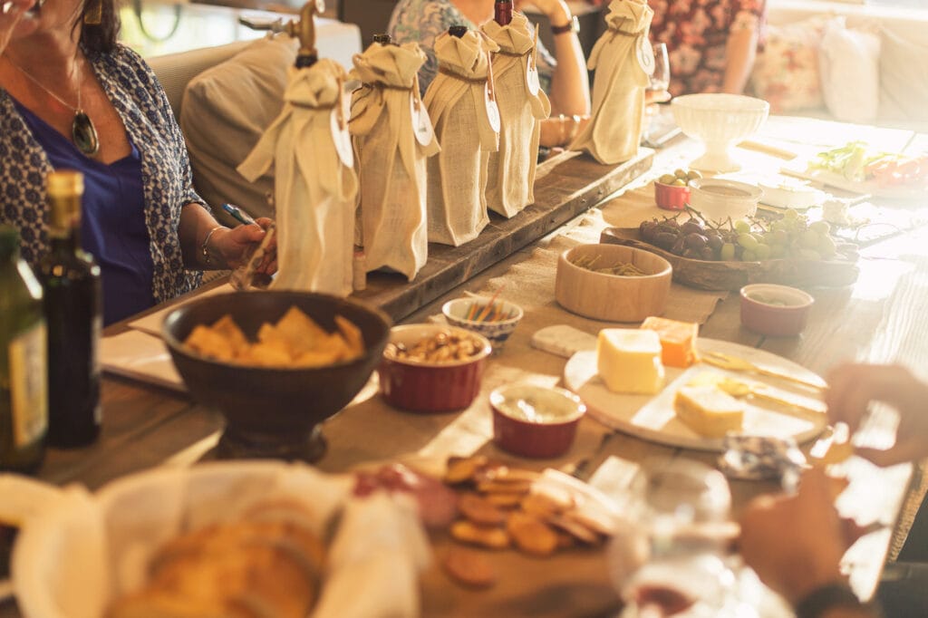 wine tasting party table spread with charcuterie board snacks