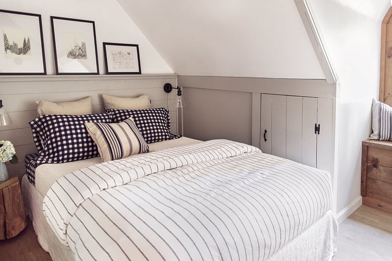 light cottage bedroom with striped bed