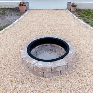 backyard fire pit with pea gravel