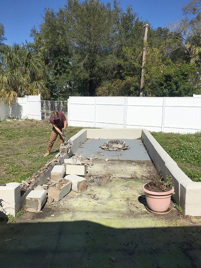 demolishing a block retaining wall