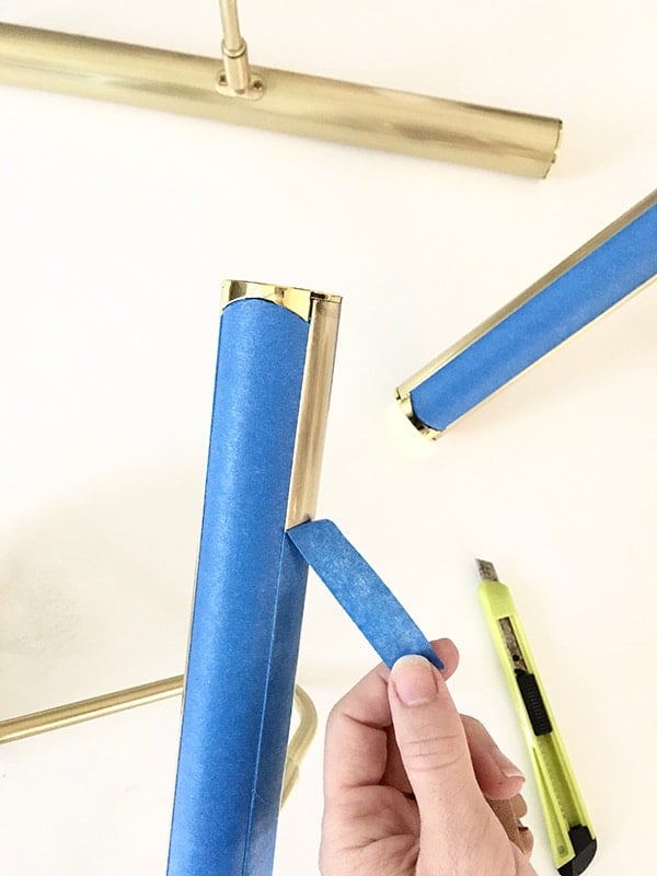 taping brass sconces