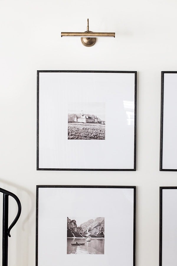 large matted frames with gold wall sconce