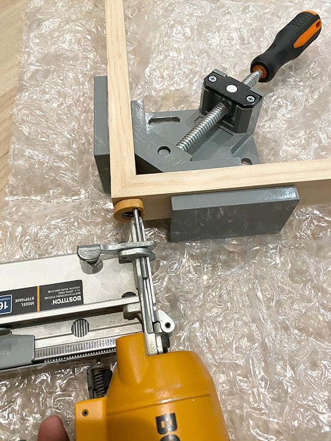 nailing in a corner of a diy tv frame