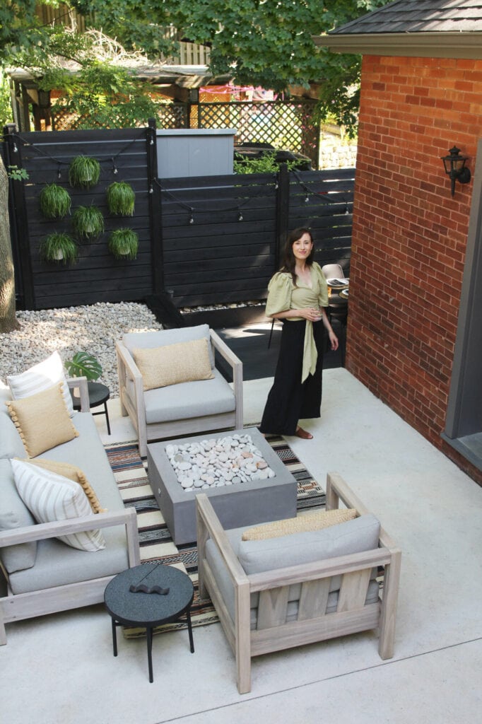 small patio with black fence and seating area