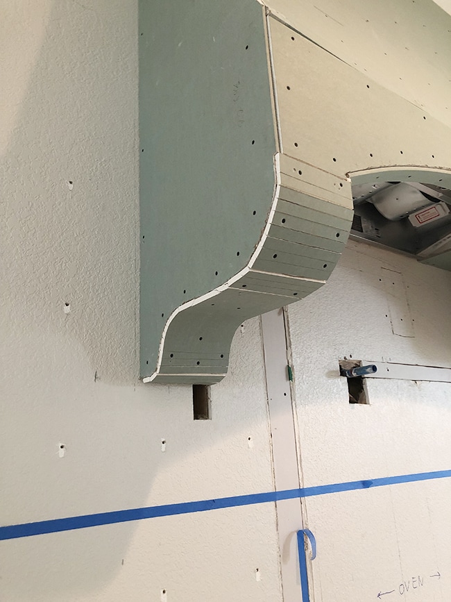 curved corbel range hood