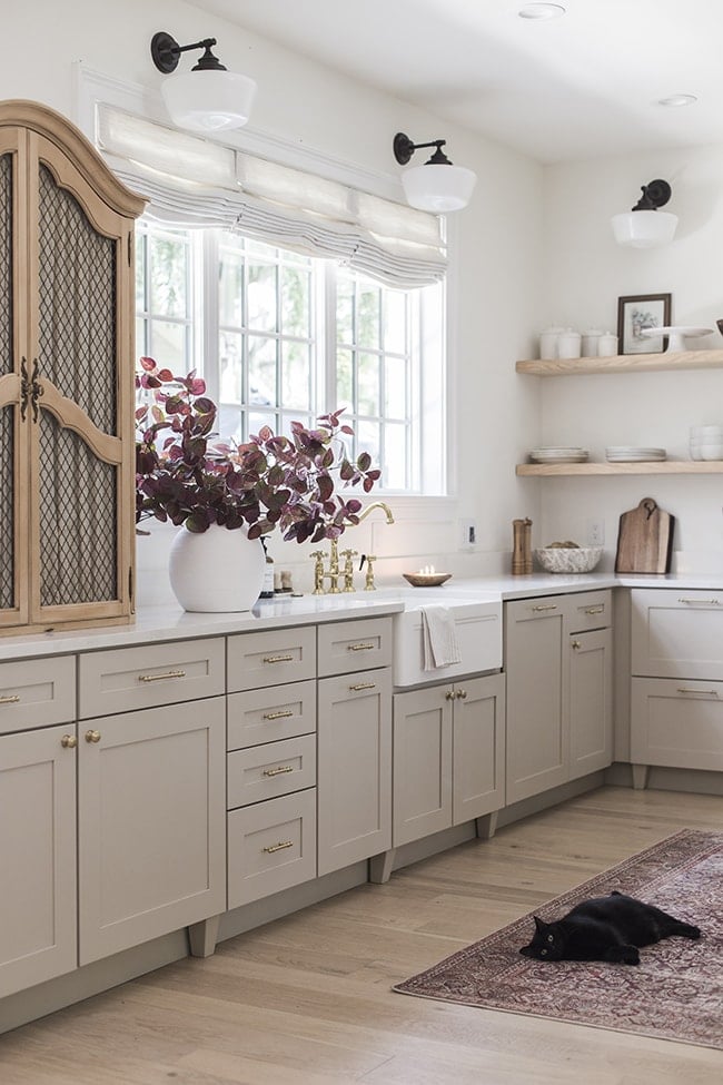 neutral light kitchen with beige cabinets and white walls