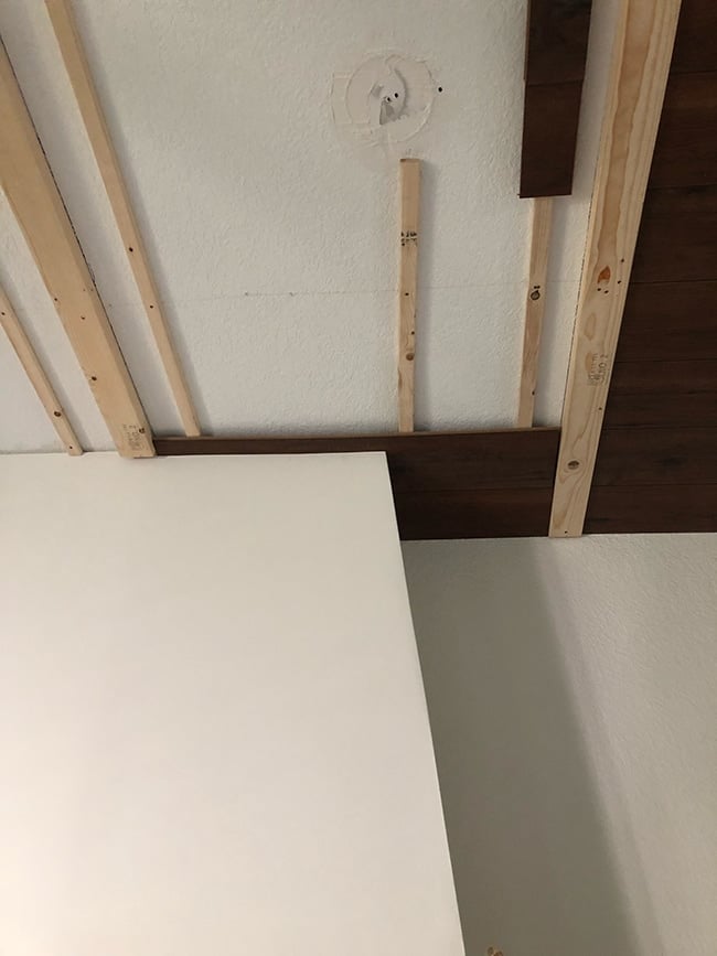 closeup laminate wood plank ceiling installation