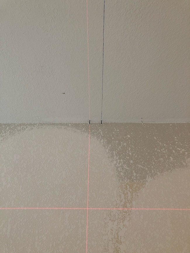 using a laser level to mark lines on a ceiling