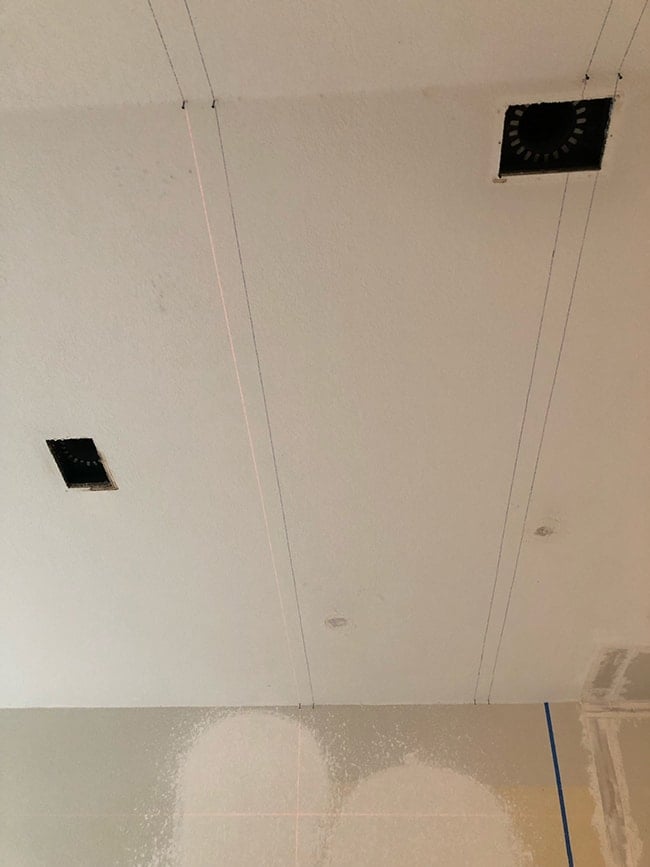 using a laser level to mark lines on a ceiling