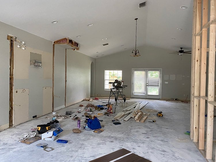 living room with vaulted ceiling before
