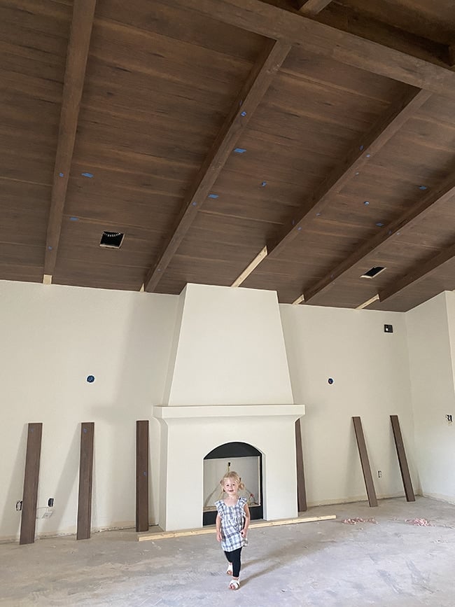 tutorial of a faux wood beam and plank ceiling using laminate floors