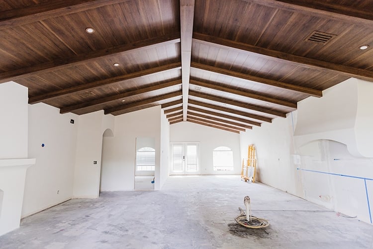 diy custom wood beam ceiling in a spanish style home