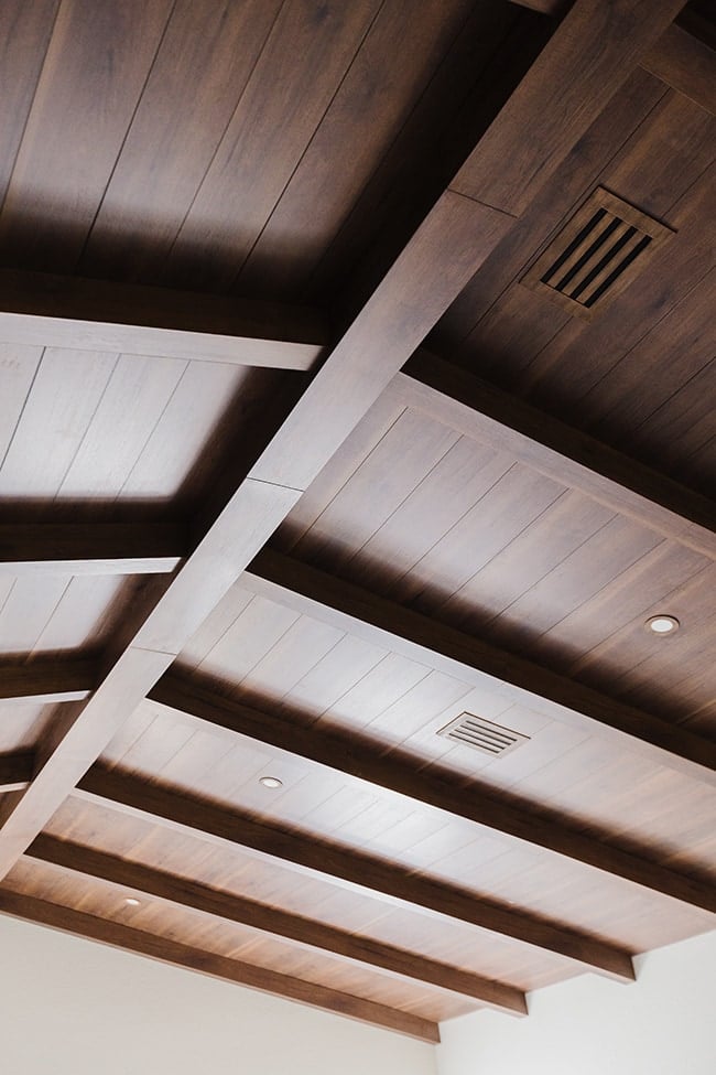 closeup of a custom wood beam and plank ceiling in a spanish style home