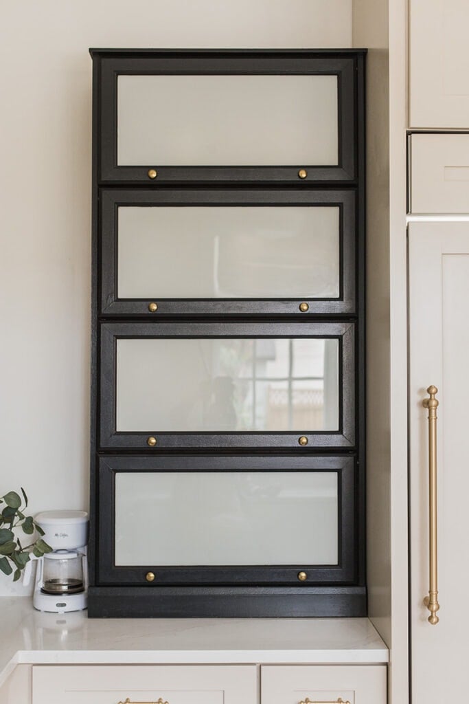 black barrister bookcase on a kitchen counter