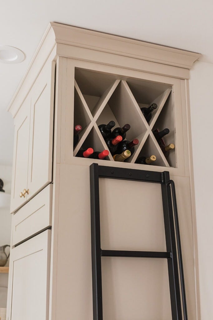wine cabinet above the fridge with ladder