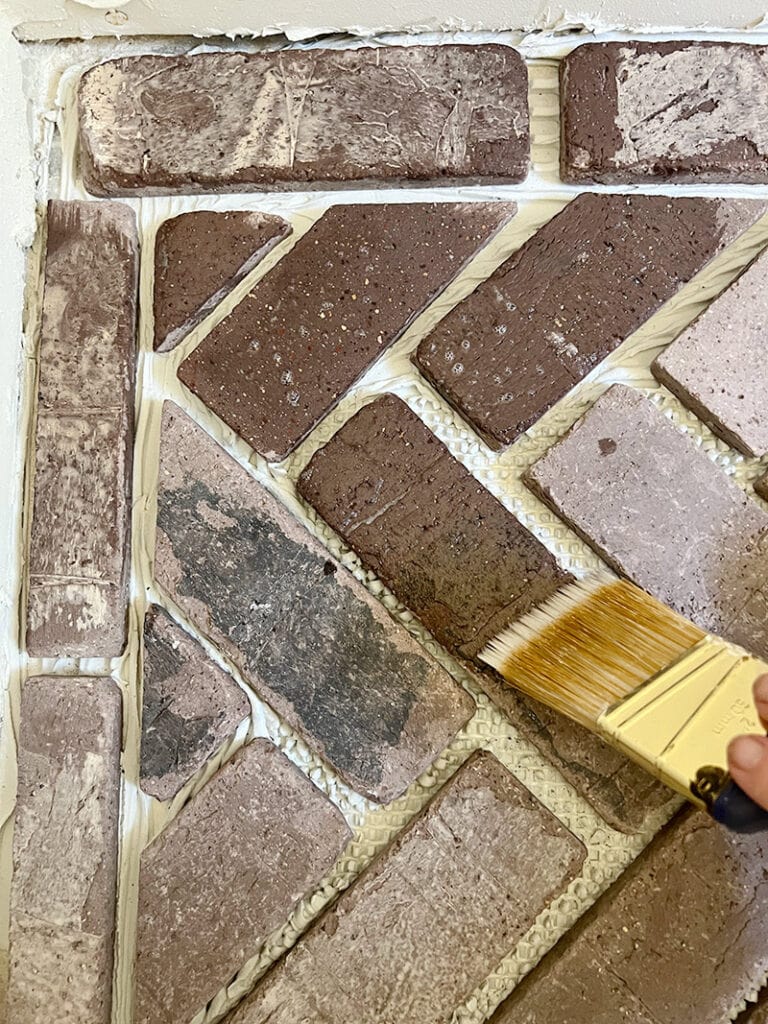 applying sealer to brick floors