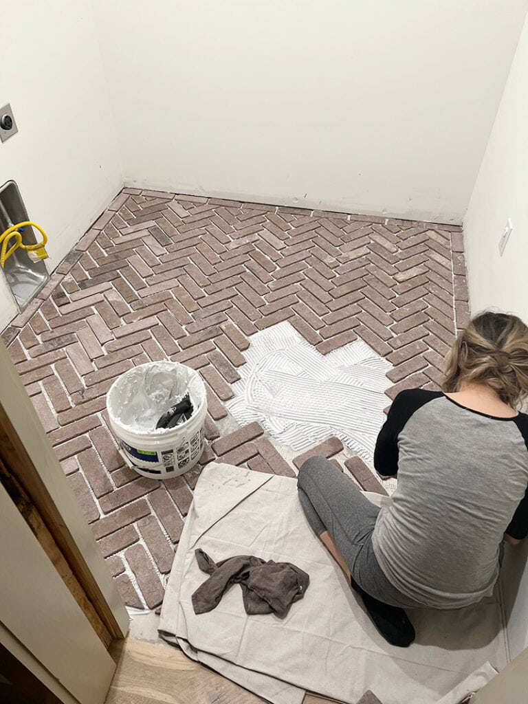 installing herringbone brick floors in a laundry room