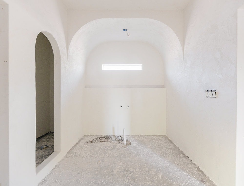 bathroom with white concrete walls