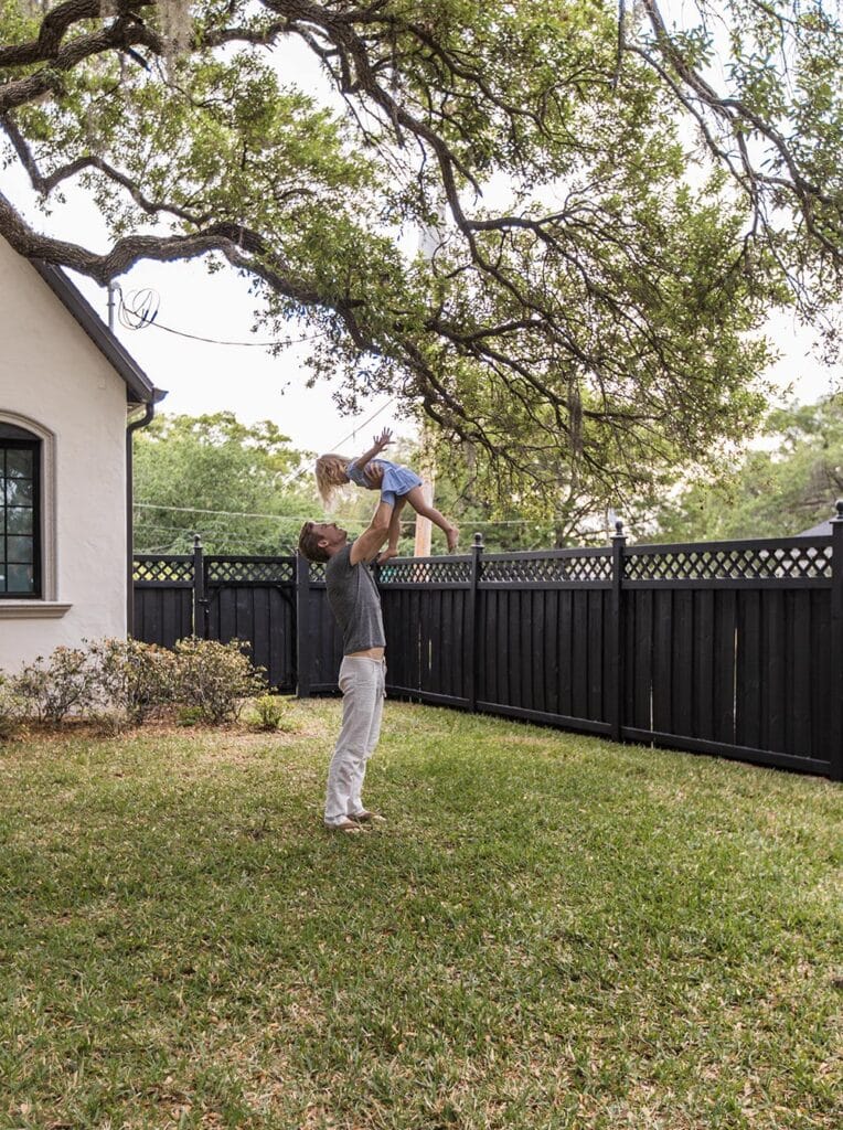 backyard black fence with lattice top