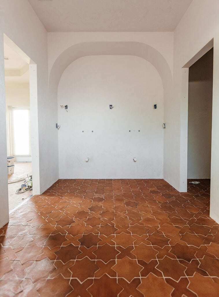 star and cross red clay tile in a bathroom