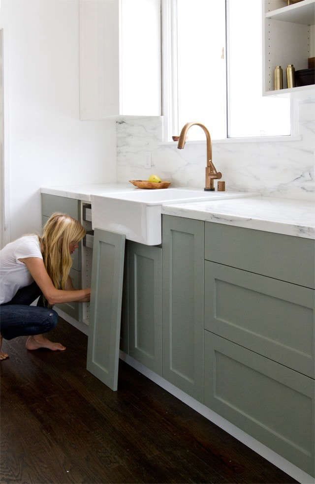 light green lower kitchen cabinets being installed