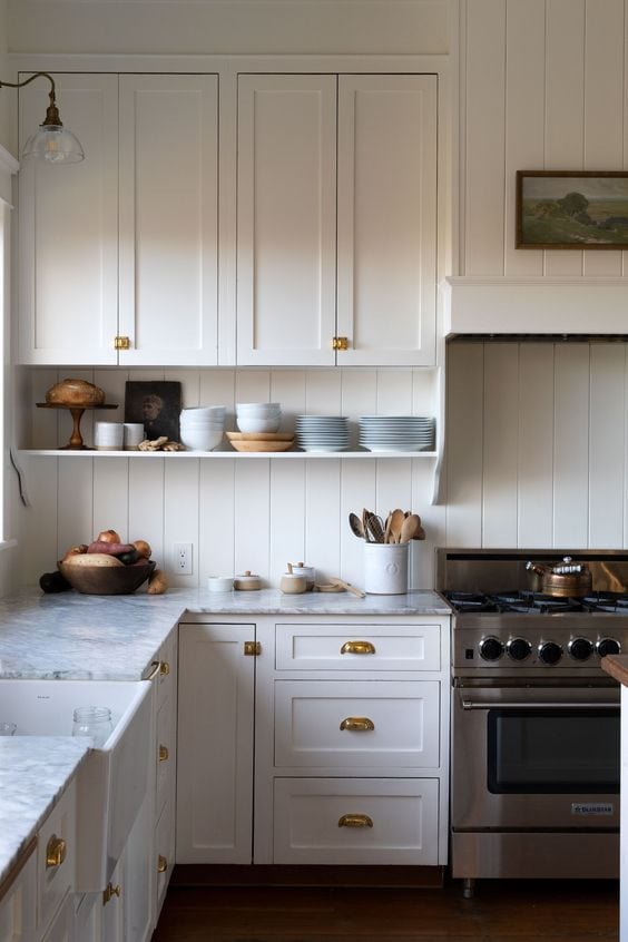 traditional white kitchen with open shelf on wall