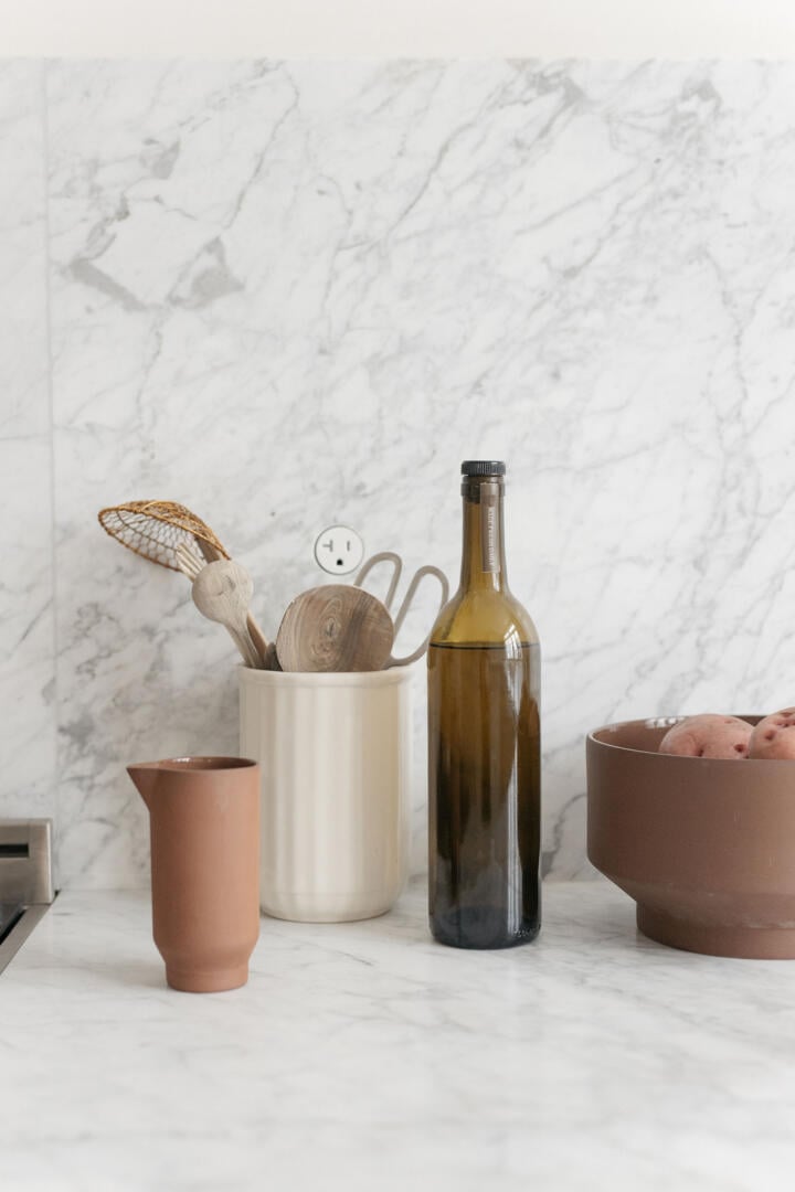 bocci hidden self contained outlet receptacle in a marble kitchen backsplash