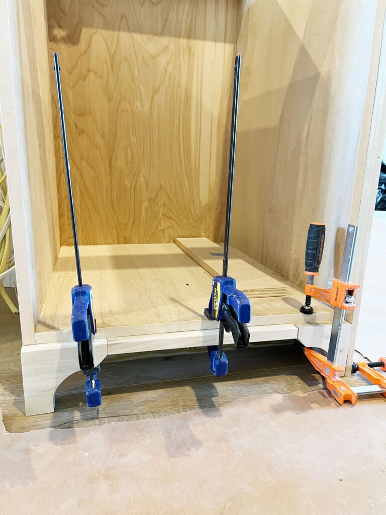 furniture feet toe kick valance clamped to a cabinet box