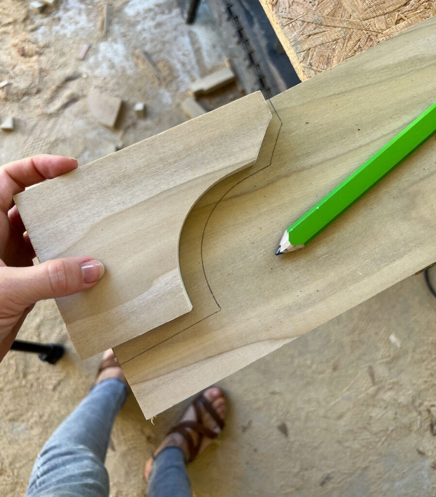 tracing a toe kick shape onto wood