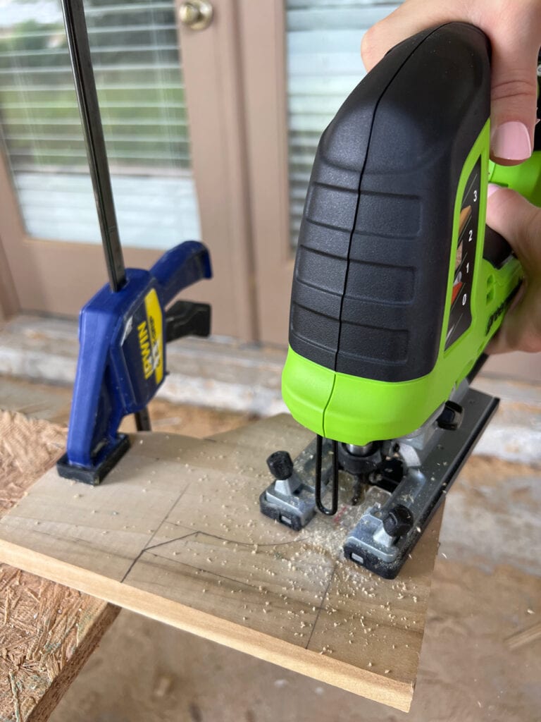 cutting out a toe kick pattern with a jigsaw