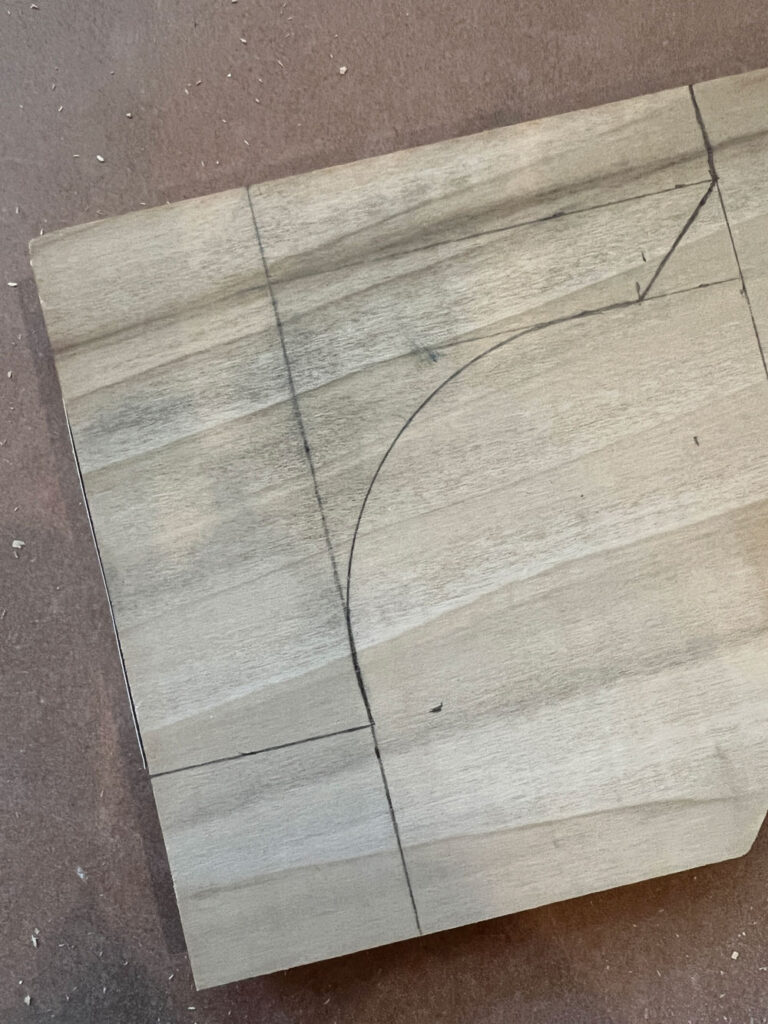outline of a custom toe kick design on wood
