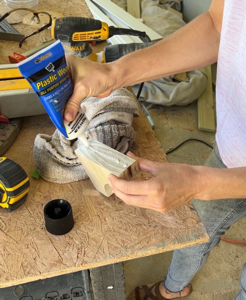 filling a gap in furniture feet with plastic wood filler