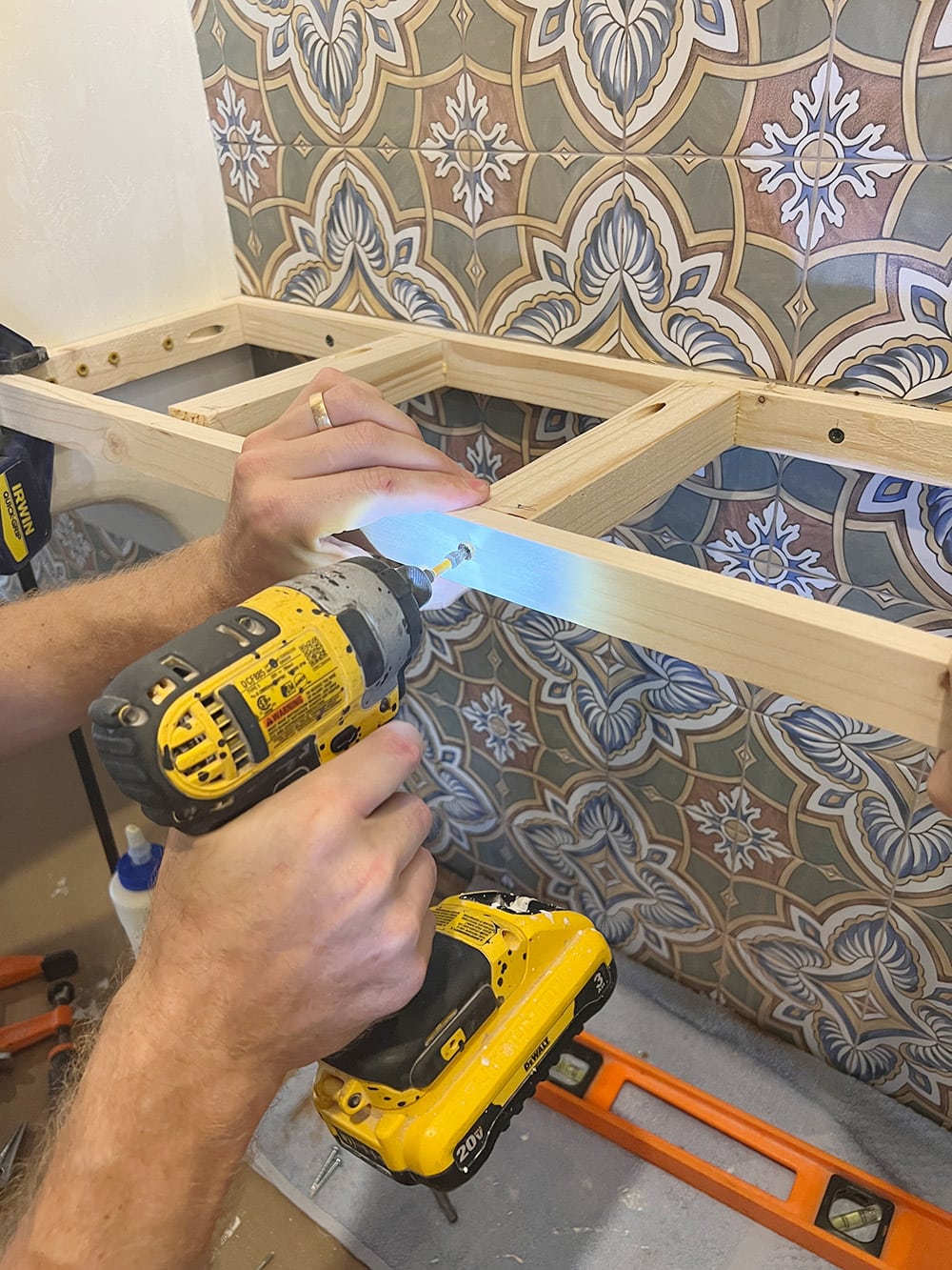 hanging floating shelves on a tiled wall