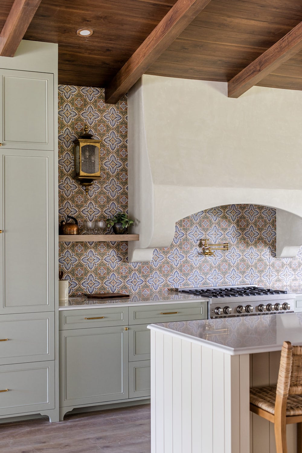 spanish style tiled green kitchen