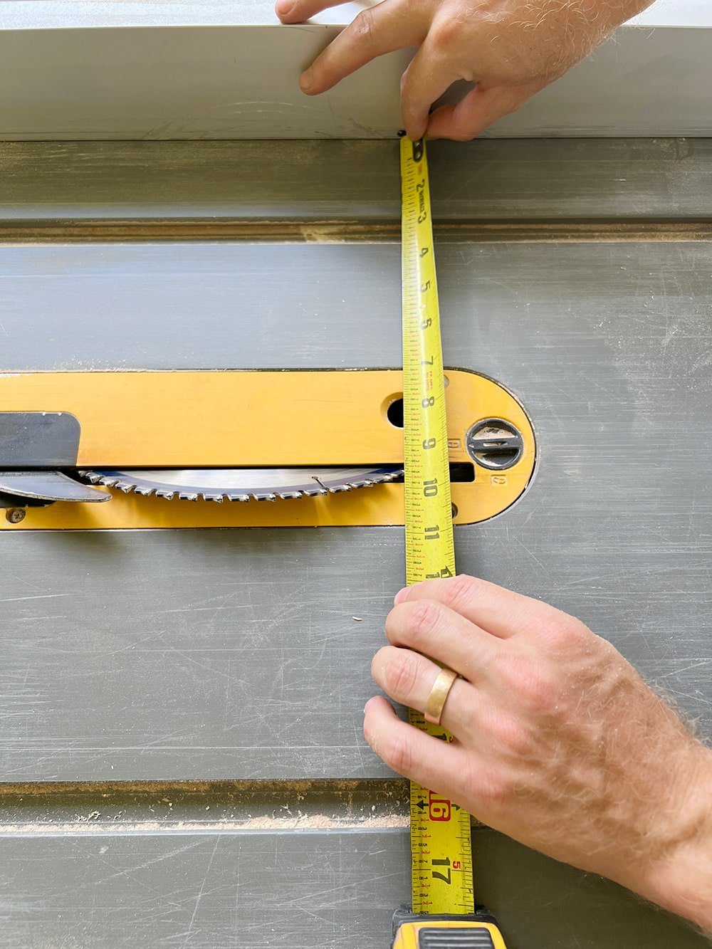 measuring a miter cut on a table saw