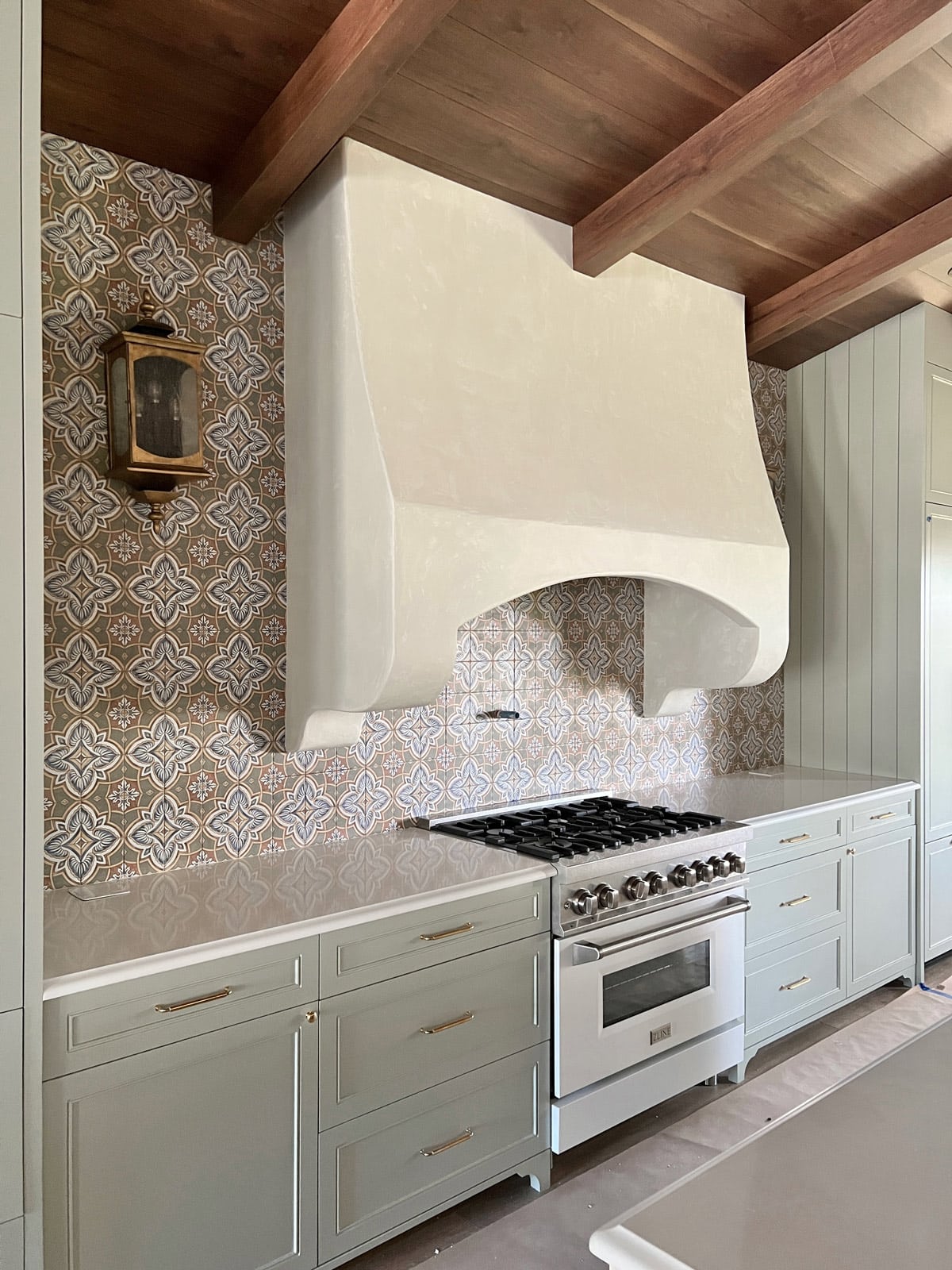 spanish style kitchen with range hood