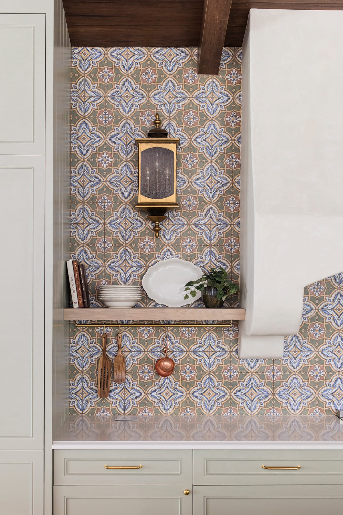 spanish tile backsplash with floating shelf