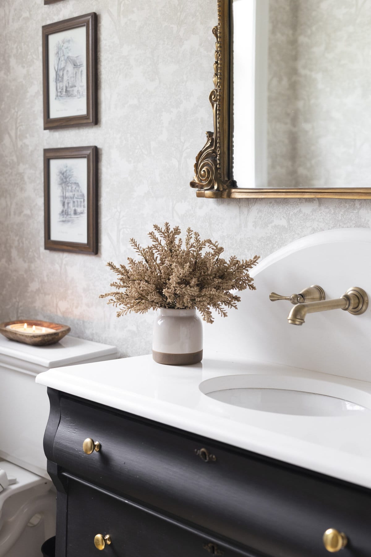 neutral bathroom with cream berry stems in a vase