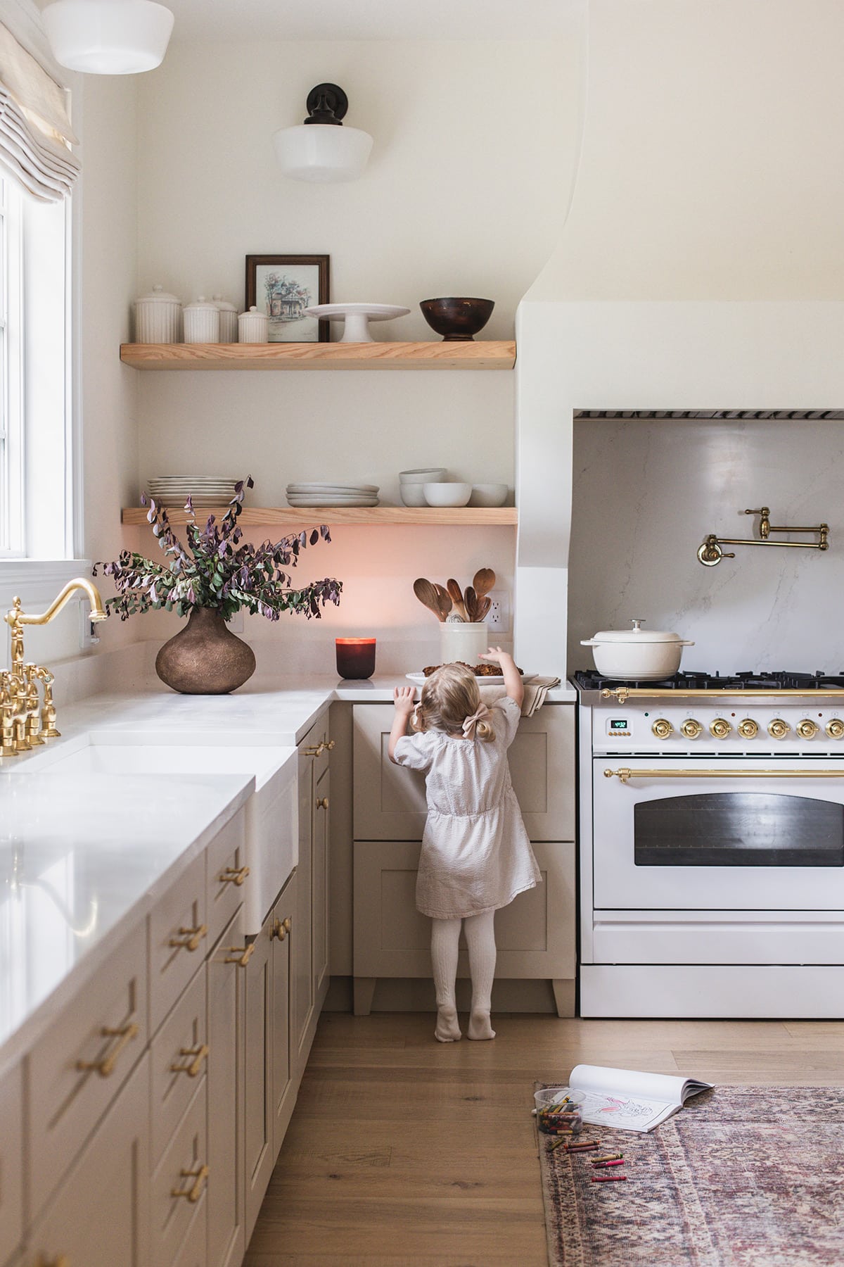 neutral fall kitchen with little girl