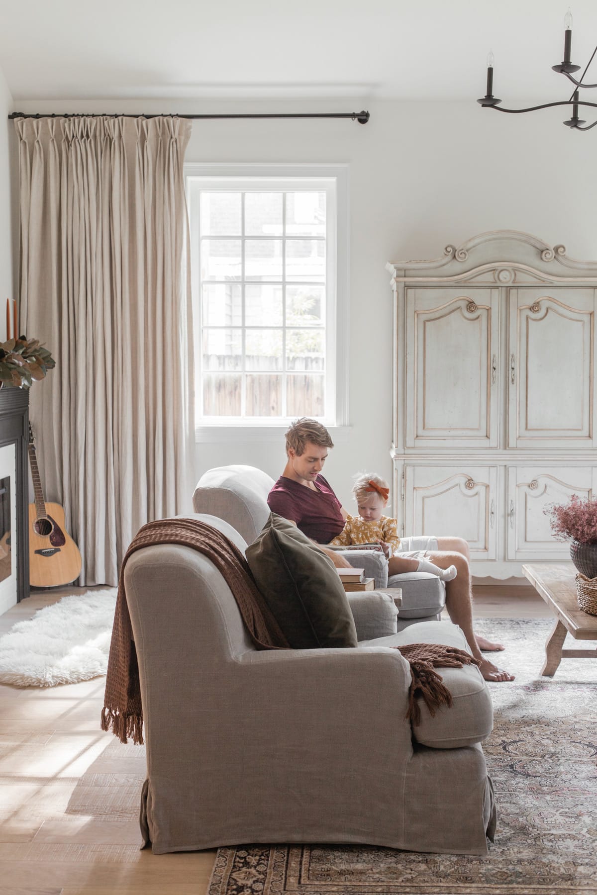 neutral living room with father and daughter