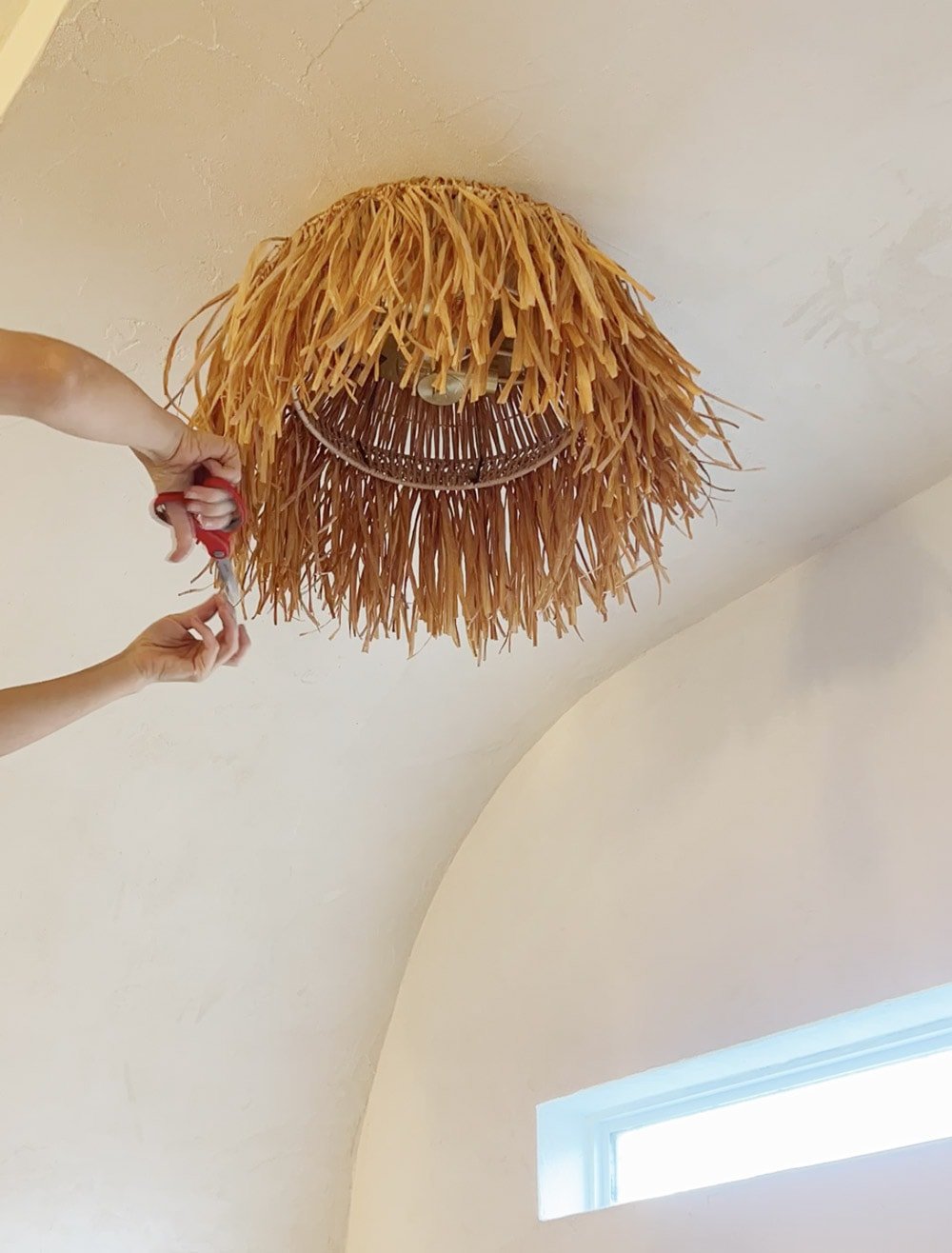 installing a diy raffia light fixture