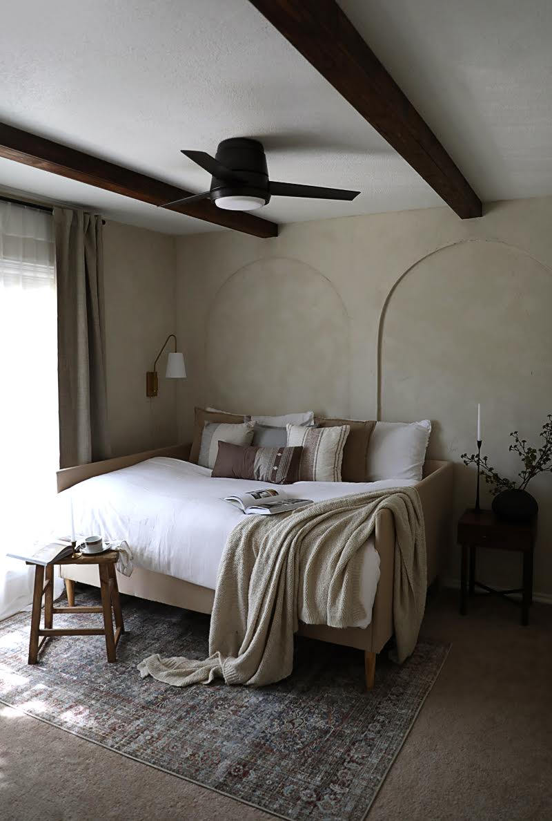 bedroom with arched walls and lime wash