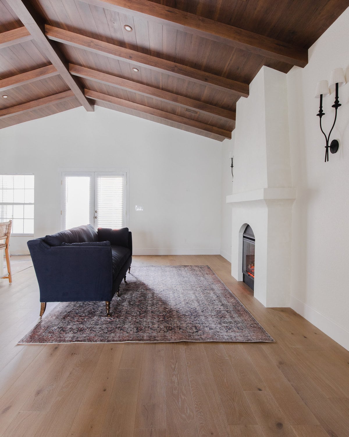 spanish style living room with wood beam ceilings sw alabaster