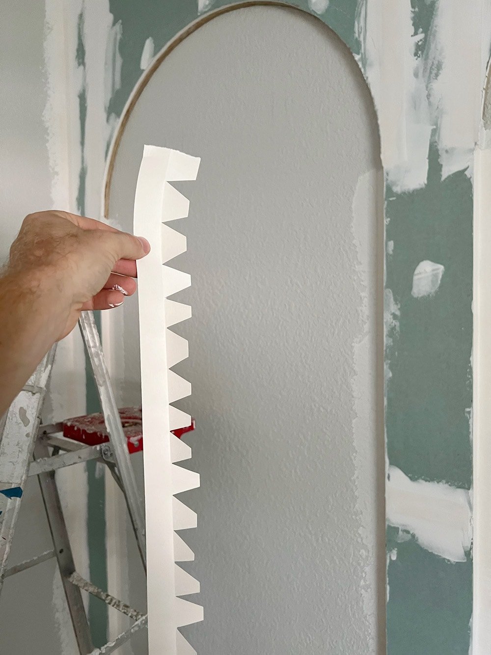 cutting joint tape to wrap around drywall arches