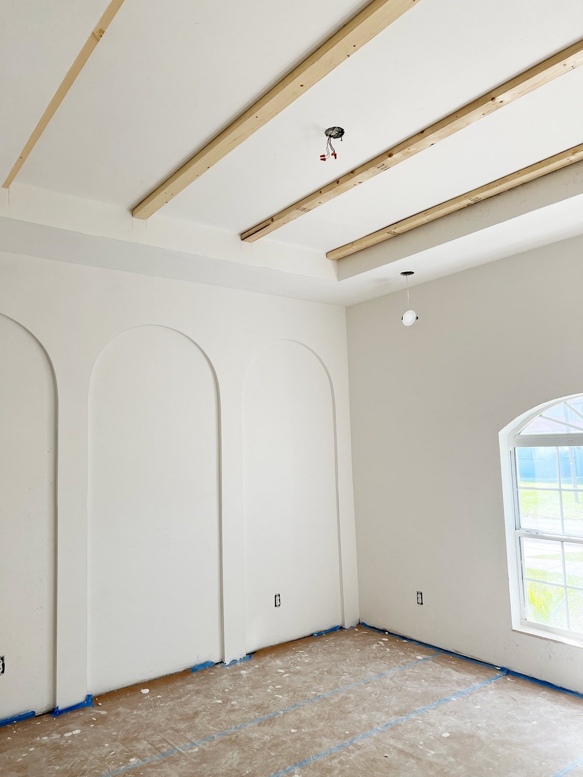 white bedroom with diy wall arches