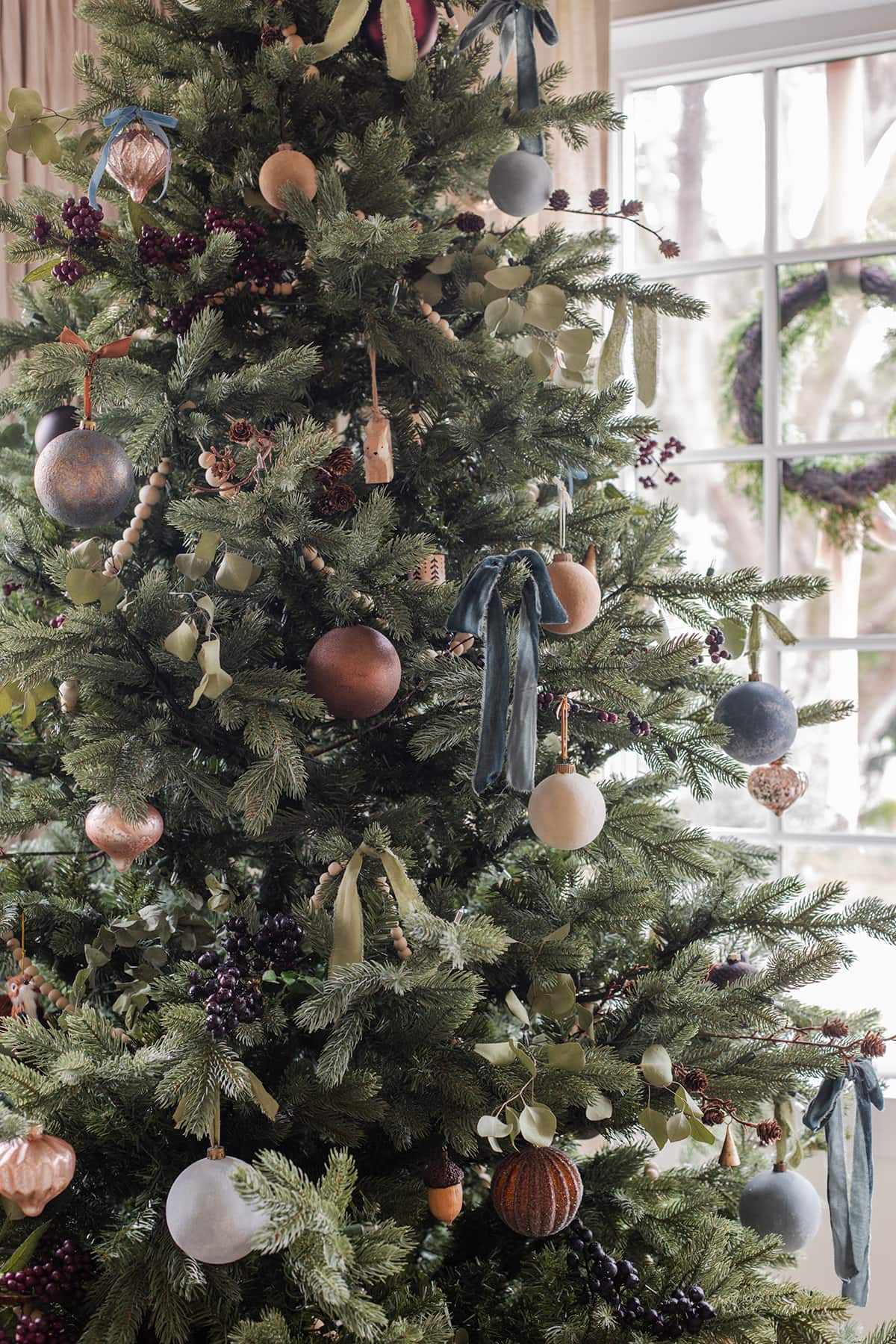 blue, gold and brown christmas tree ornaments and ribbon