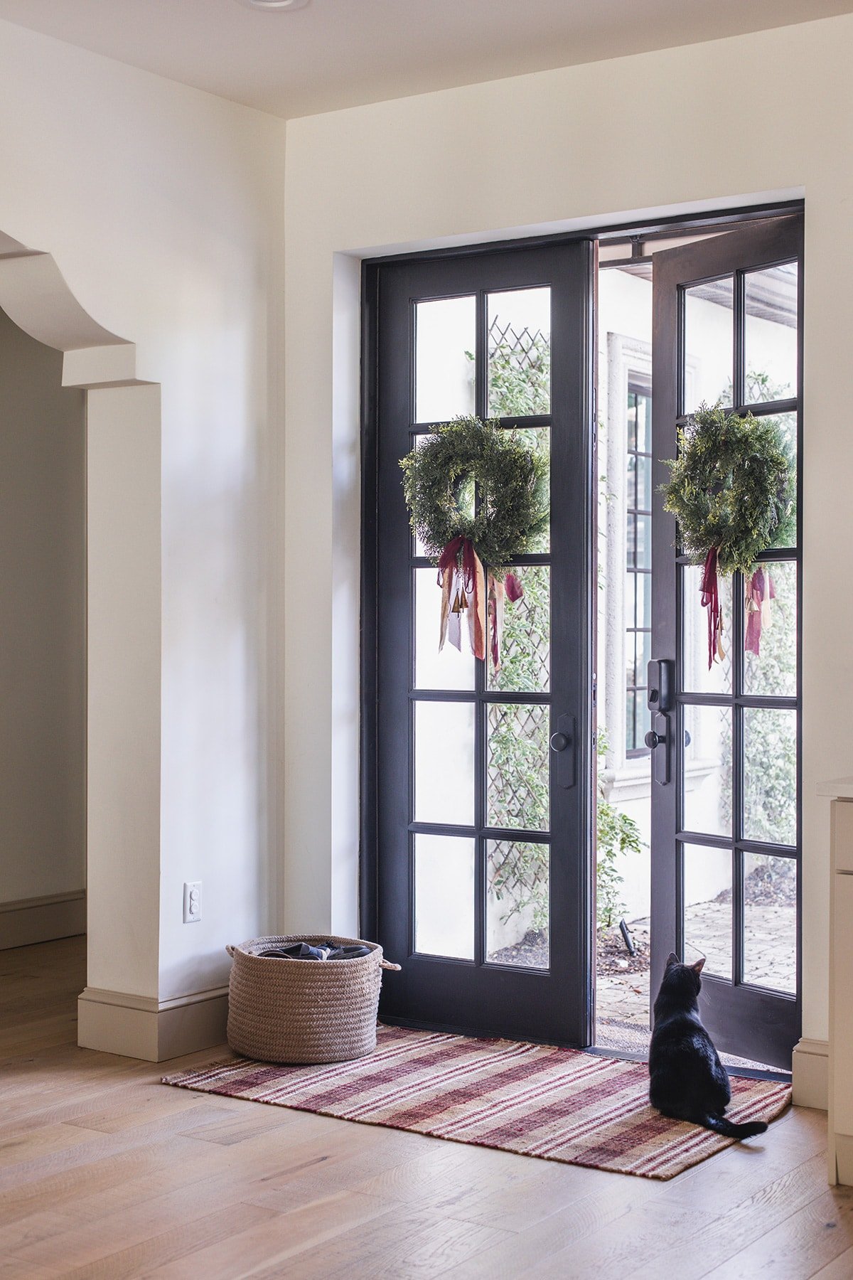 black patio french doors with christmas wreaths